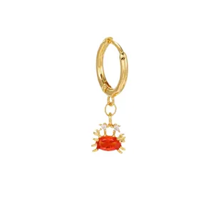 Golden hoop earring with ocean series crab charm and oval red crystal pendant