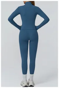 Rear view of sleek navy blue yoga set showing slim fit zipper top and high waist leggings