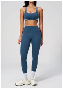 Detail of high waist yoga leggings and sports bra with white contrast stitching