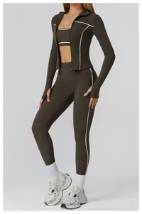 Detail of olive green yoga set with contrast stripes and thumbhole sleeve design