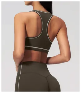 Detail view of the racerback sports bra and high-waisted leggings in olive green