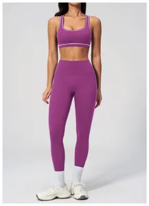 Detail of burgundy yoga set featuring contrast white stitching and high waist fit