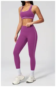 Detailed view of purple yoga set featuring contrast white stitching and ribbed fabric