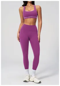 Detail of purple yoga set featuring white contrast stitching on high-waist leggings
