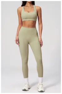 Detailed close-up of bean green high waist yoga pants and racerback sports bra set