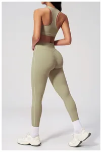 Close-up of sage green yoga set showing high-waist leggings with white side stripes