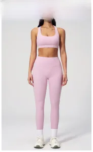 Close-up of cherry blossom pink yoga set featuring racerback top and leggings