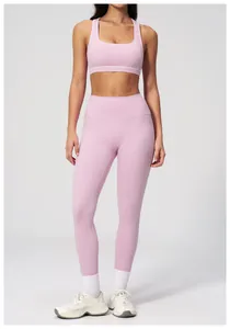 Detail of light pink two-piece yoga set featuring square-neck top and high-waist leggings