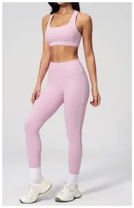 Detail of pink yoga bra and leggings with decorative white contrast stitching