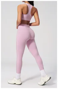 Detail of pink yoga set with white contrast piping and high-waist stretch leggings
