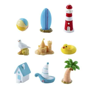 9-piece miniature beach island landscape set with lighthouse, surfboard, and palm tree