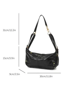 Elegant black quilted shoulder bag with gold hardware and stylish dumpling design