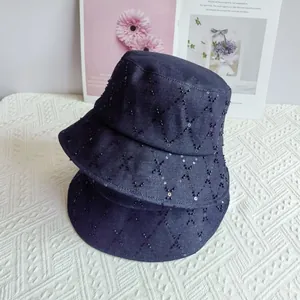 Quilted denim bucket hat with black sequins and diamond pattern in dark blue finish