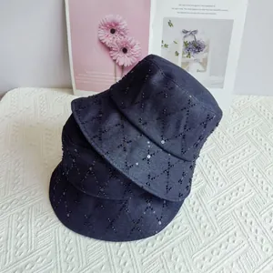 Quilted dark blue denim bucket hats featuring black sequins and diamond lattice patterns