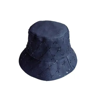 Deep blue denim bucket hat featuring black sequin diamond pattern and stylish quilting