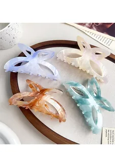 Vue détaillée de quatre pinces à cheveux papillon en lilas, jaune, ambre et bleu