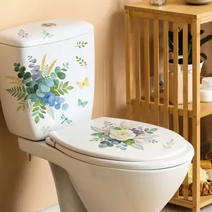 Detailed view of watercolor flower and butterfly stickers applied to a white toilet