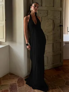 Elegant black halter maxi dress with deep V-neck and pleated fabric texture for women