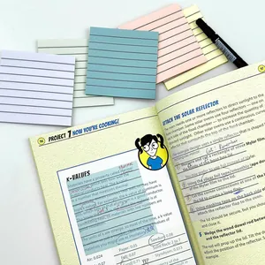 Macro shot of Morandi colored index tabs on a scientific textbook with a marker