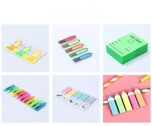 Macro view of Morandi color transparent sticky notes and arrow shape index tabs