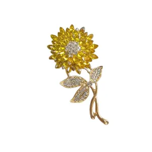 Elegant yellow crystal sunflower brooch with gold leaves and sparkling white rhinestones