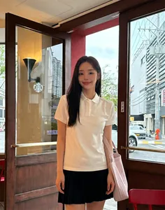 Lifestyle view of large striped canvas tote bag paired with Korean style casual outfit