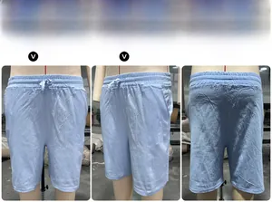 Three-point view of light blue linen shorts featuring elastic waist and drawstring
