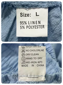 Detailed laundry tag of linen beach shorts showing size L and care instructions