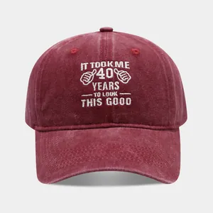 Detailed embroidery of slogan on burgundy vintage washed cotton baseball cap