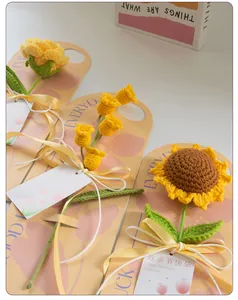 Close-up of handmade crochet sunflower and rose bouquet with Mother's Day card