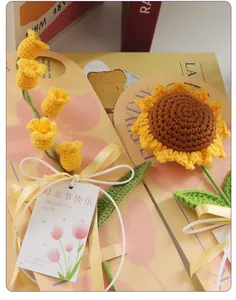 Detail of handcrafted crochet sunflower and tulip bouquet with Mother's Day gift card