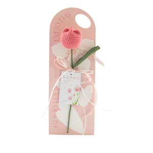 Handmade pink knitted tulip flower bouquet with premium gift packaging and white ribbon