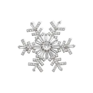 Elegant silver snowflake brooch with sparkling cubic zirconia for luxury suits