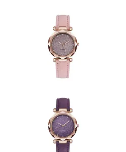 Macro detail of starry glitter dial watches with faceted rose gold case and leather strap