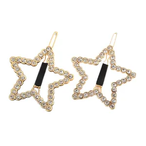Set de dos pinzas para el cabello con forma de estrella dorada y cristales brillantes