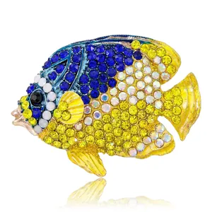 Spilla a forma di pesce tropicale con cristalli blu e gialli su base dorata