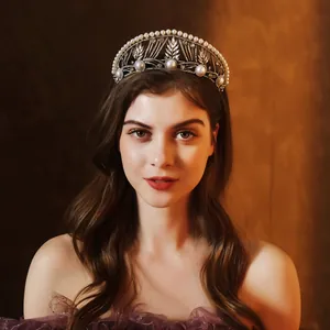 Detailed view of luxury baroque crown with large pearls and leaf-shaped crystals