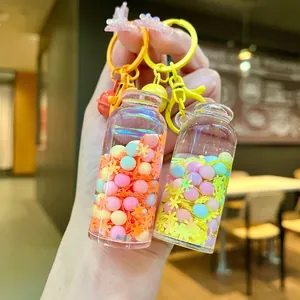 Close-up of drifting bottle keychain with macaron beads and snowflake sequins