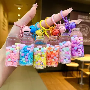 Set of six colorful liquid glitter drifting bottle keychains with bells for bags