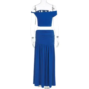 Detail of royal blue crop top and pleated maxi skirt set with elegant waist ruching