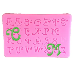 Pink silicone mold for A-Z decorative capital letters with embossed green clay samples