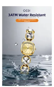 Golden watch with large crystal links splashing in water showing 3ATM water resistance