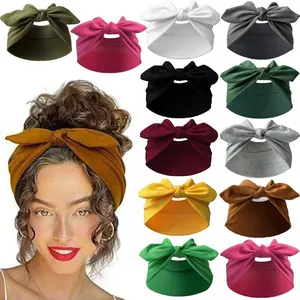 Close-up of wide elastic bow headbands shown in 11 solid colors for yoga and sports