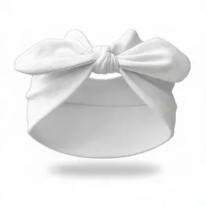 Close-up of soft white elastic knotted headband with large bow detail for yoga