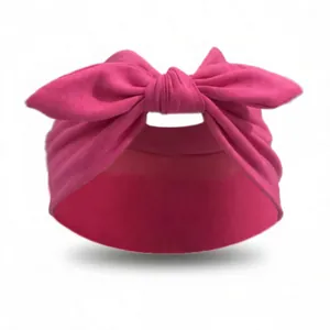 Close-up of rose red elastic yoga headband with large decorative knot detail