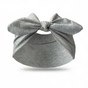 Close-up of grey elastic knot headband showing soft knitted texture and bow detail