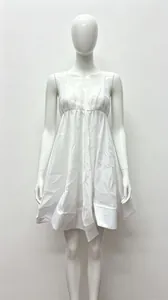 Detail of white V-neck mini dress with high waist pleats and voluminous silhouette