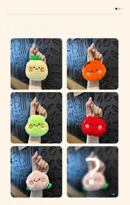 Close-up of assorted plush fruit keychains showing detailed soft textures and metal chains