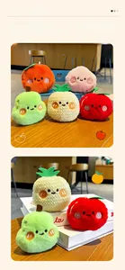 Detail of plush fruit keychains with embroidery showing soft texture and hanging loops