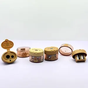 Detail view of the dual-hole capybara pencil sharpener showing open lid and blade structure